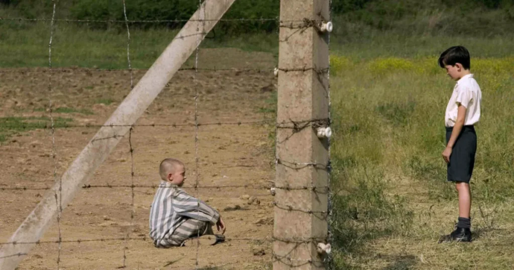 Two boys talking through a fence in a concentration camp - emotional scene from The Boy in the Striped Pajamas